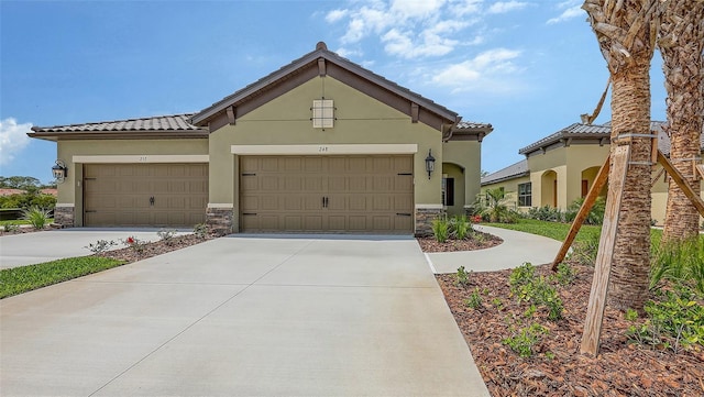 248 Altamura Cir, Nokomis, FL 34275 - view of front of home featuring stone siding, concrete driveway, and stucco siding