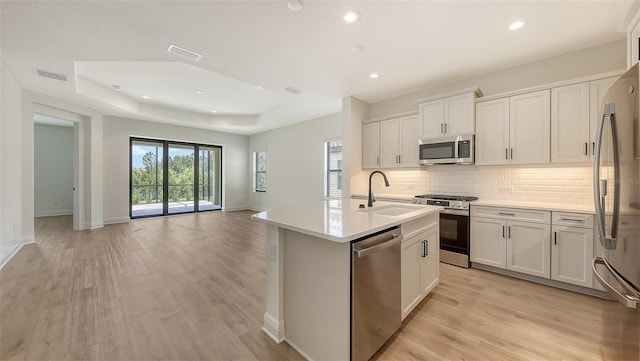 248 Altamura Cir, Nokomis, FL 34275 - kitchen with appliances with stainless steel finishes, healthy amount of natural light, light wood-style floors, and recessed lighting
