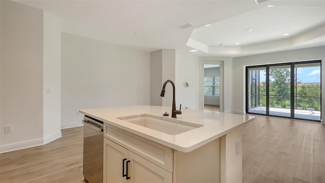 248 Altamura Cir, Nokomis, FL 34275 - kitchen with stainless steel dishwasher, open floor plan, a tray ceiling, light countertops, and recessed lighting