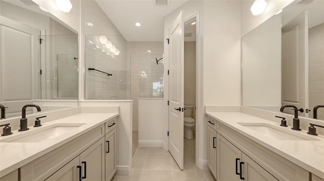 248 Altamura Cir, Nokomis, FL 34275 - full bath with two vanities, tile patterned floors, tiled shower, and recessed lighting