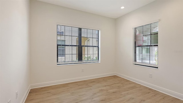 248 Altamura Cir, Nokomis, FL 34275 - unfurnished room with healthy amount of natural light, light wood finished floors, and recessed lighting