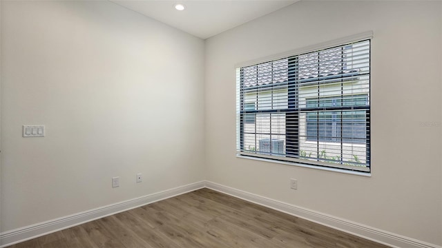 248 Altamura Cir, Nokomis, FL 34275 - empty room featuring wood finished floors and recessed lighting