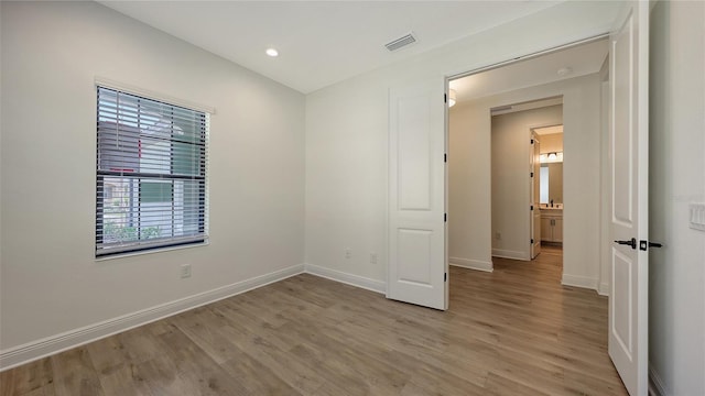 248 Altamura Cir, Nokomis, FL 34275 - unfurnished bedroom with light wood-style flooring and recessed lighting