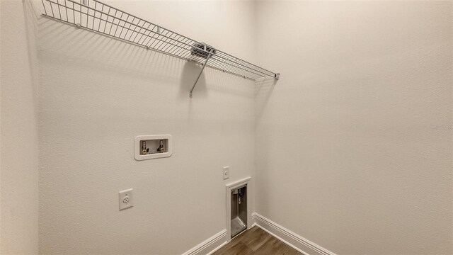 248 Altamura Cir, Nokomis, FL 34275 - laundry room featuring electric dryer hookup, dark wood-type flooring, and hookup for a washing machine