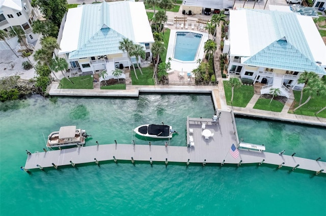 999 Inlet Cir Unit 103, Venice, FL 34285 - drone / aerial view of a pool and a large body of water