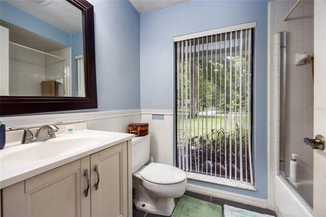 4310 NW 65th Ter, Gainesville, FL 32606 - full bath featuring vanity, shower / tub combination, and wainscoting