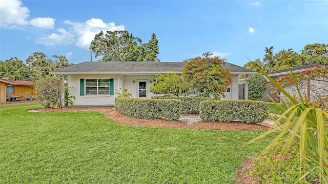 2088 Grove St, Sarasota, FL 34239 - view of front facade with a front lawn and stucco siding