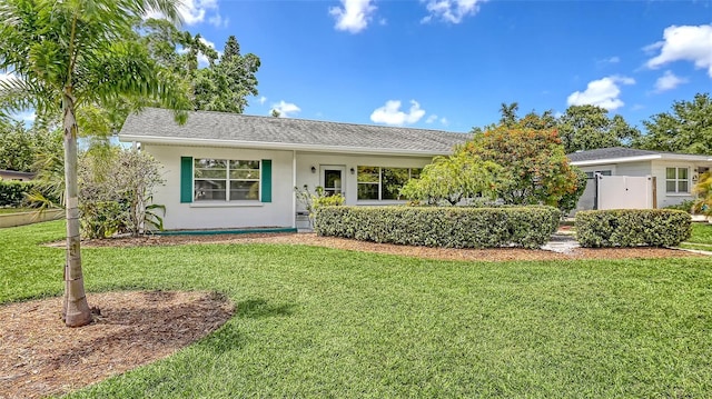 2088 Grove St, Sarasota, FL 34239 - ranch-style home featuring a front yard and roof with shingles