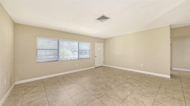 2088 Grove St, Sarasota, FL 34239 - unfurnished room featuring light tile patterned floors and baseboards