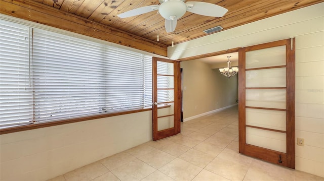 2088 Grove St, Sarasota, FL 34239 - unfurnished room featuring a chandelier, light tile patterned flooring, ceiling fan, and wood ceiling