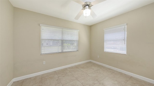 2088 Grove St, Sarasota, FL 34239 - empty room featuring a ceiling fan, plenty of natural light, and light tile patterned floors