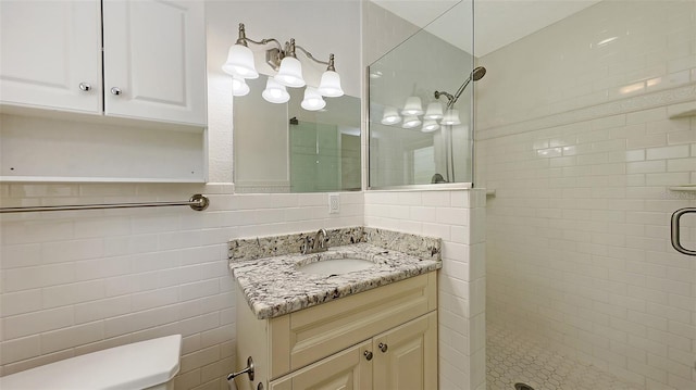 2088 Grove St, Sarasota, FL 34239 - full bathroom featuring tiled shower, vanity, and tile walls