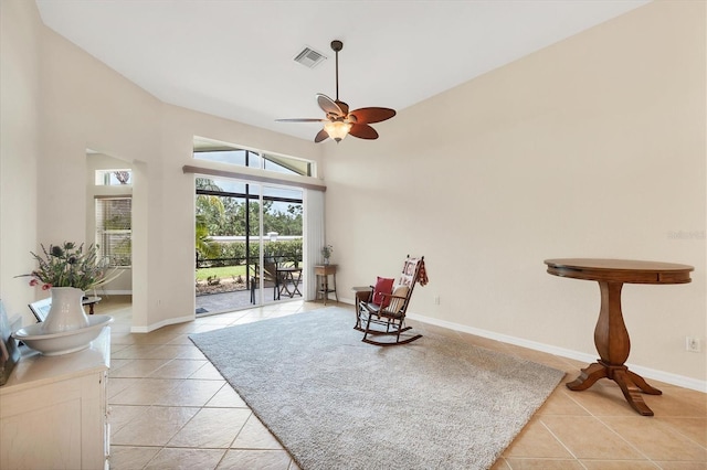 6312 41st Ct E, Sarasota, FL 34243 - living area featuring light tile patterned floors and a ceiling fan