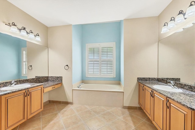 6312 41st Ct E, Sarasota, FL 34243 - bathroom featuring two vanities, a bath, and tile patterned floors
