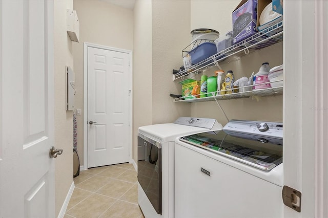 6312 41st Ct E, Sarasota, FL 34243 - laundry room featuring independent washer and dryer and light tile patterned floors