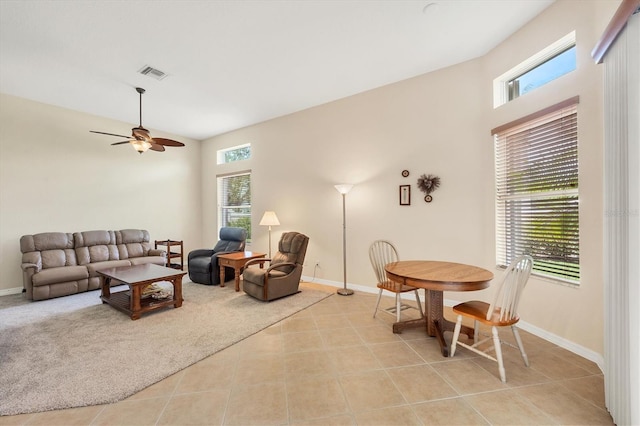 6312 41st Ct E, Sarasota, FL 34243 - living area featuring a ceiling fan, light tile patterned floors, and a high ceiling