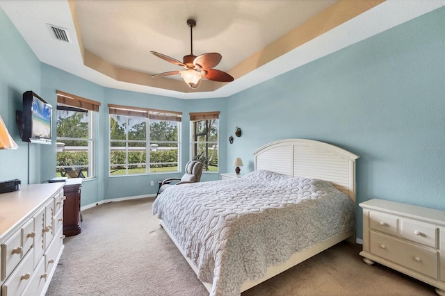 6312 41st Ct E, Sarasota, FL 34243 - carpeted bedroom featuring a raised ceiling and a ceiling fan