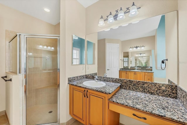 6312 41st Ct E, Sarasota, FL 34243 - full bathroom featuring a stall shower, healthy amount of natural light, and two vanities