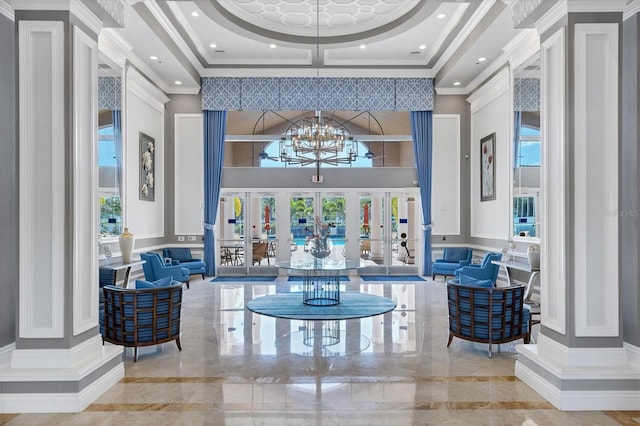 6312 41st Ct E, Sarasota, FL 34243 - community lobby with a high ceiling, coffered ceiling, a decorative wall, and ornamental molding