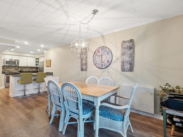 8710 Midnight Pass Rd Unit 205, Sarasota, FL 34242 - dining area with crown molding, dark wood-style flooring, recessed lighting, and a chandelier
