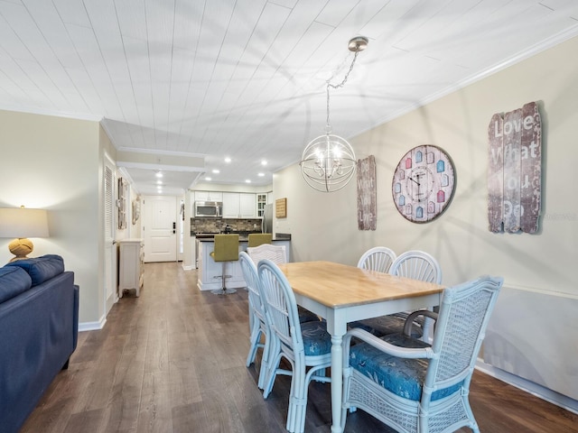 8710 Midnight Pass Rd Unit 205, Sarasota, FL 34242 - dining space with ornamental molding, dark wood-style floors, a chandelier, and recessed lighting