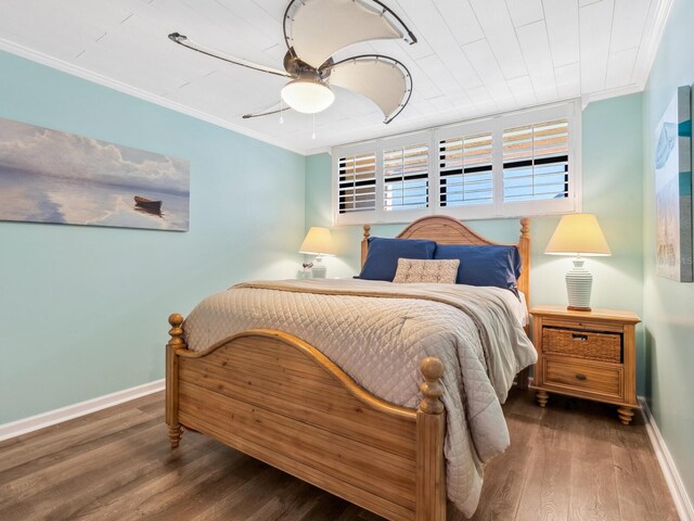 8710 Midnight Pass Rd Unit 205, Sarasota, FL 34242 - bedroom with ornamental molding, wood finished floors, and a ceiling fan