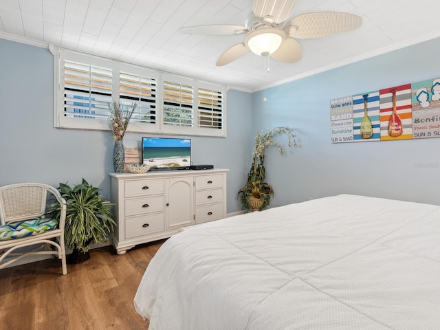 8710 Midnight Pass Rd Unit 205, Sarasota, FL 34242 - bedroom featuring wood finished floors, crown molding, and ceiling fan