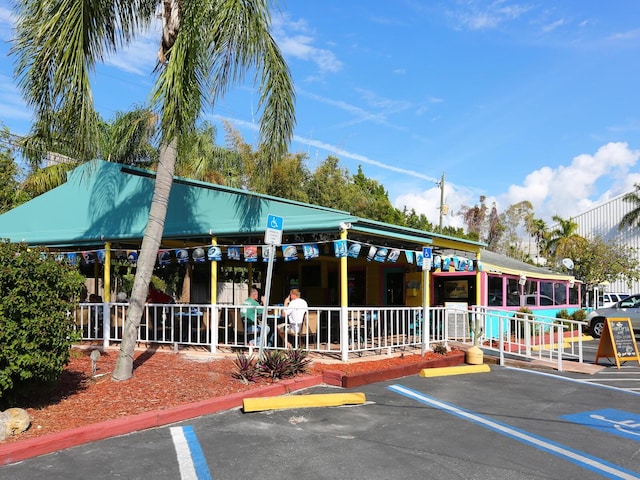 8710 Midnight Pass Rd Unit 205, Sarasota, FL 34242 - view of building exterior featuring uncovered parking