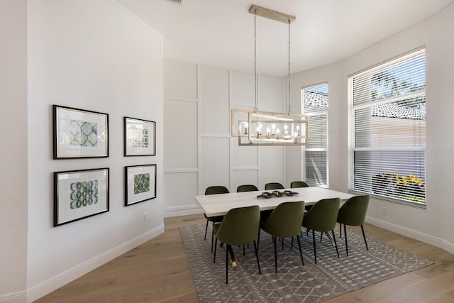 7211 Marston Ct, University Park, FL 34201 - dining space featuring light wood-type flooring and a chandelier