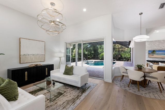 7211 Marston Ct, University Park, FL 34201 - living room with wood finished floors, recessed lighting, a chandelier, and a high ceiling