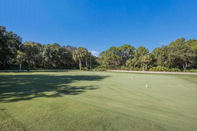 7211 Marston Ct, University Park, FL 34201 - surrounding community with view of scattered trees and an area to practice putting