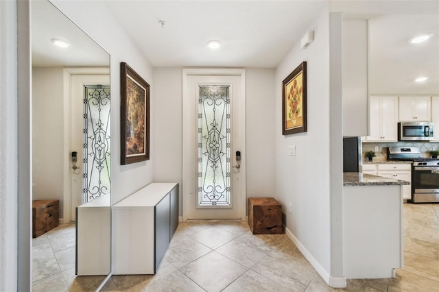 5916 Wake Forest Run Unit 101, Bradenton, FL 34211 - foyer featuring recessed lighting and light tile patterned floors
