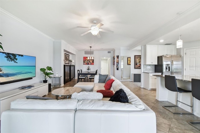 5916 Wake Forest Run Unit 101, Bradenton, FL 34211 - living room featuring a ceiling fan, a chandelier, light tile patterned floors, and ornamental molding