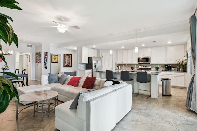 5916 Wake Forest Run Unit 101, Bradenton, FL 34211 - living room featuring a ceiling fan, recessed lighting, light tile patterned floors, and ornamental molding