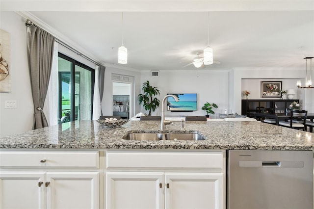 5916 Wake Forest Run Unit 101, Bradenton, FL 34211 - kitchen featuring stainless steel dishwasher, white cabinets, light stone countertops, crown molding, and pendant lighting
