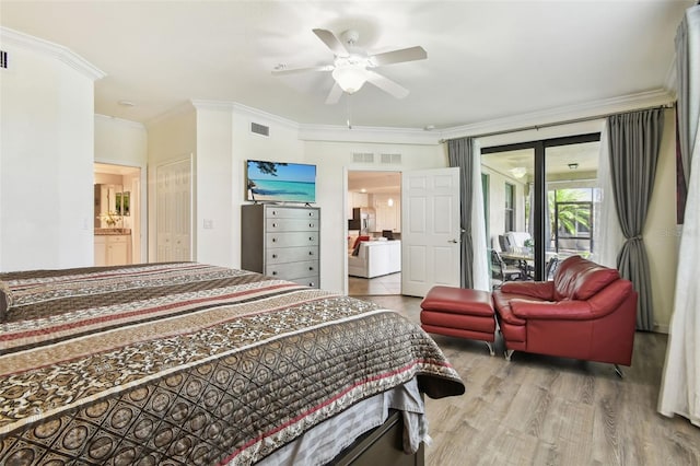 5916 Wake Forest Run Unit 101, Bradenton, FL 34211 - bedroom with wood finished floors, access to outside, crown molding, a ceiling fan, and connected bathroom