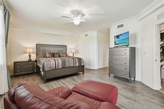 5916 Wake Forest Run Unit 101, Bradenton, FL 34211 - bedroom with ornamental molding, wood finished floors, and ceiling fan