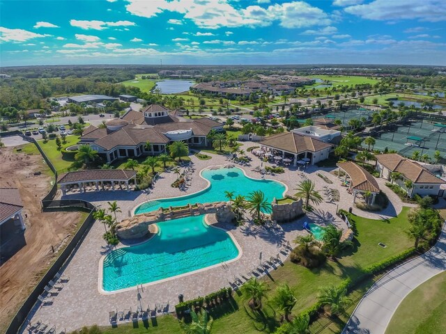 5916 Wake Forest Run Unit 101, Bradenton, FL 34211 - aerial perspective of suburban area with a pool area and a nearby body of water