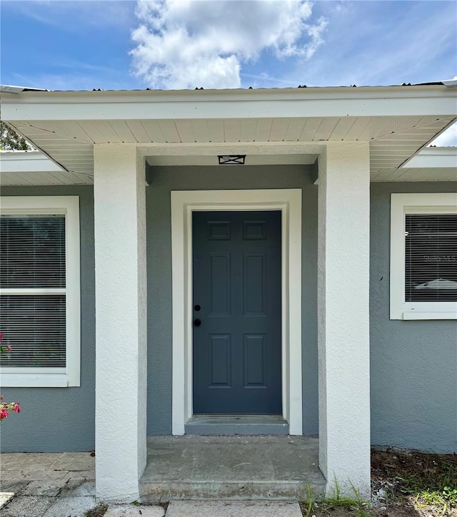 811 24th Street Ct E, Bradenton, FL 34208 - view of exterior entry with stucco siding