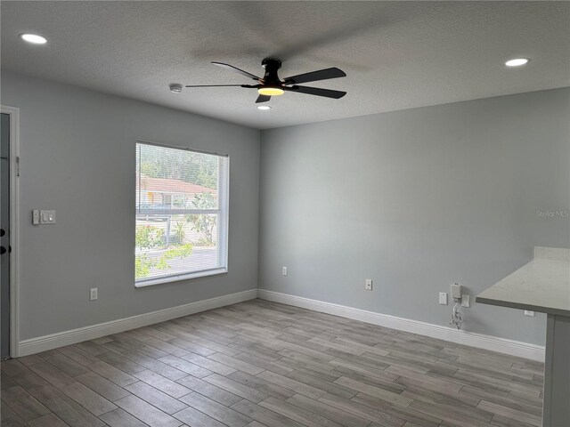 811 24th Street Ct E, Bradenton, FL 34208 - spare room featuring ceiling fan, wood finished floors, recessed lighting, and a textured ceiling
