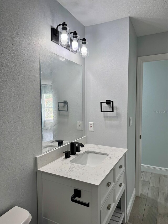811 24th Street Ct E, Bradenton, FL 34208 - bathroom featuring vanity and wood finished floors