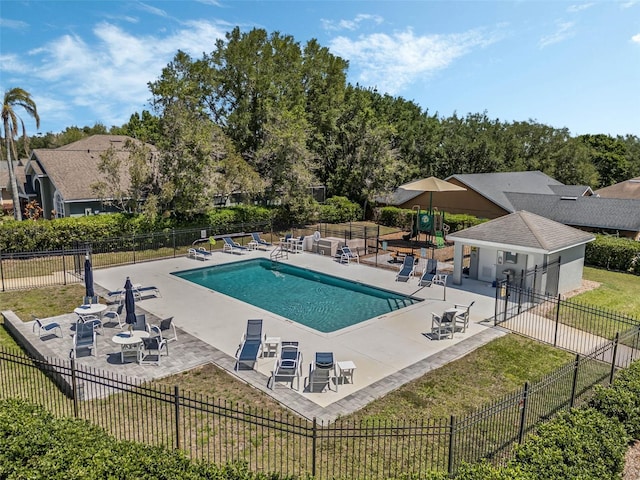 17426 Tailfeather Ct, Clermont, FL 34711 - community pool featuring a patio