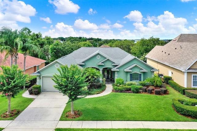 17426 Tailfeather Ct, Clermont, FL 34711 - ranch-style house featuring stucco siding, a front yard, concrete driveway, and an attached garage
