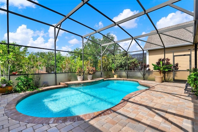 17426 Tailfeather Ct, Clermont, FL 34711 - swimming pool with a patio area and glass enclosure