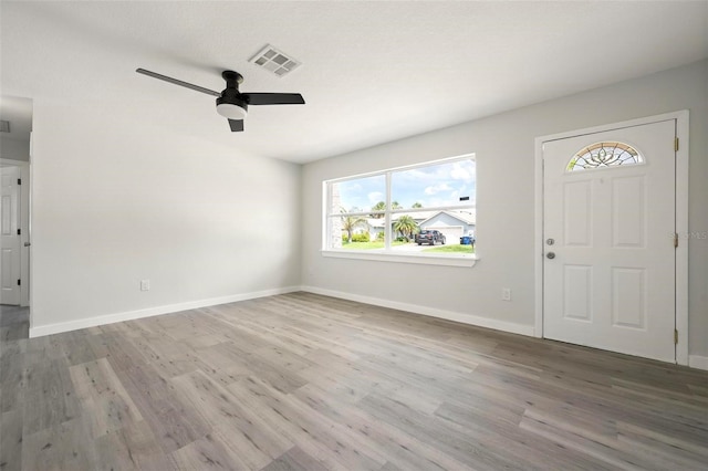 609 Carmel Rd, Venice, FL 34293 - entrance foyer featuring wood finished floors, plenty of natural light, and a ceiling fan