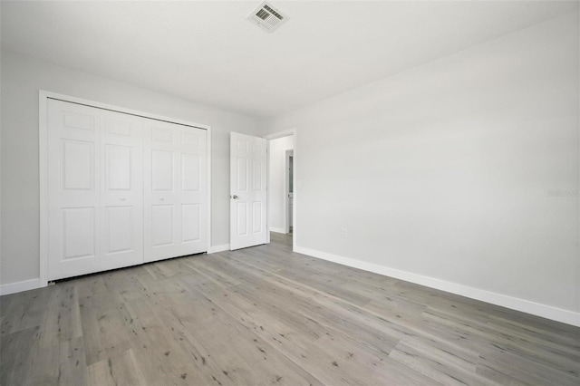 609 Carmel Rd, Venice, FL 34293 - unfurnished bedroom with wood finished floors and a closet