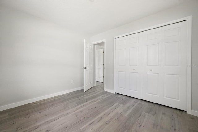 609 Carmel Rd, Venice, FL 34293 - unfurnished bedroom with wood finished floors and a closet