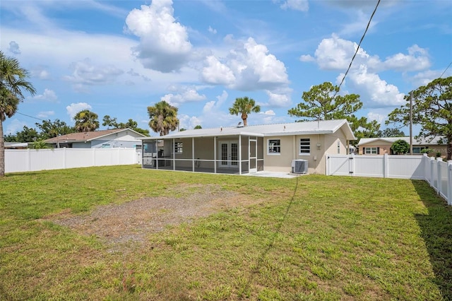 609 Carmel Rd, Venice, FL 34293 - rear view of house with a sunroom, french doors, a fenced backyard, a gate, and a metal roof