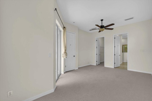 7026 43rd Ave E, Palmetto, FL 34221 - unfurnished bedroom featuring carpet, ceiling fan, and a spacious closet