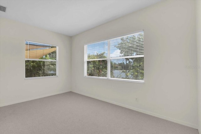 7026 43rd Ave E, Palmetto, FL 34221 - unfurnished room with light colored carpet and baseboards